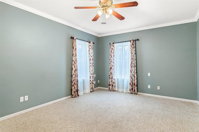 carpeted empty room featuring ceiling fan and ornamental molding