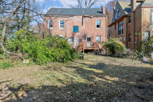 back of house with a yard