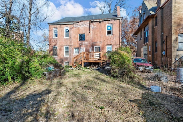 rear view of house with a wooden deck