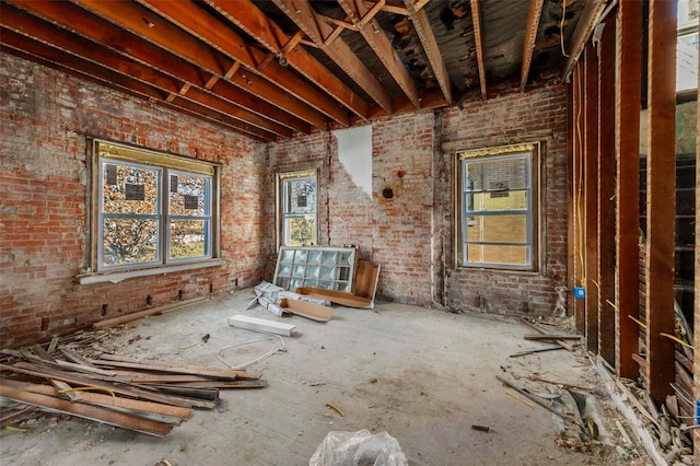 miscellaneous room with brick wall