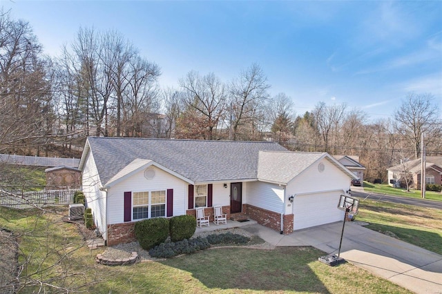 ranch-style home with a front yard, covered porch, a garage, and central air condition unit