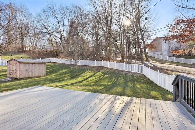 wooden terrace featuring a lawn