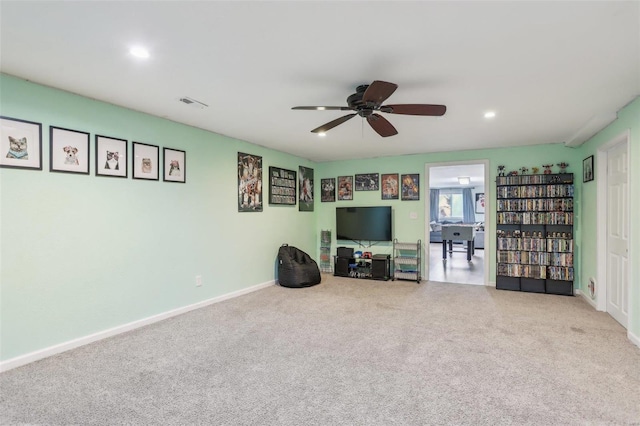 unfurnished room with ceiling fan and carpet floors