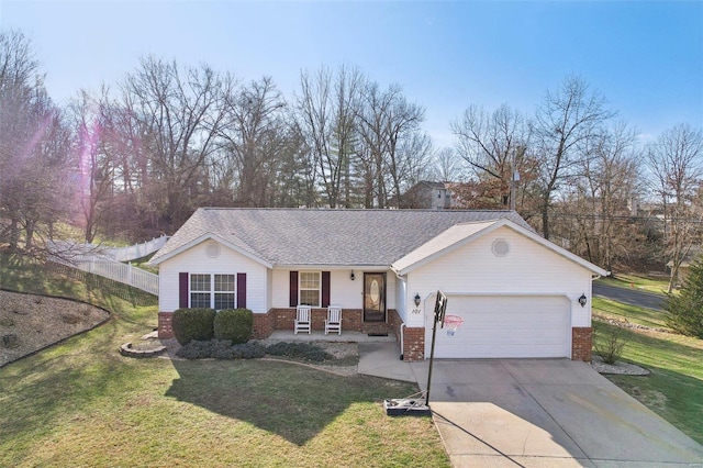 single story home with a garage, a porch, and a front yard