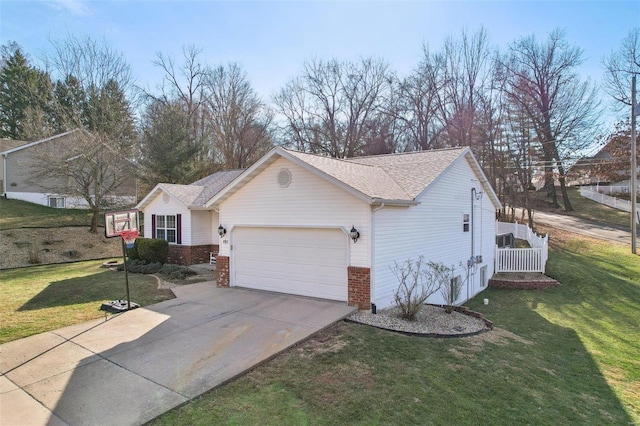 ranch-style home with a garage and a front yard