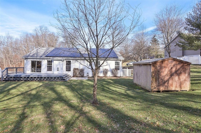 view of yard featuring a deck and a shed