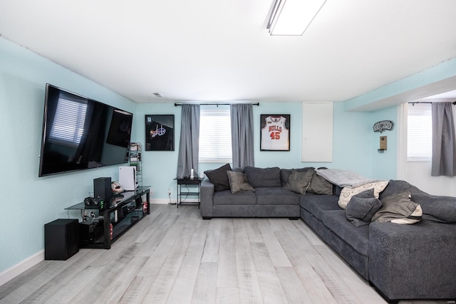 living room with light hardwood / wood-style flooring