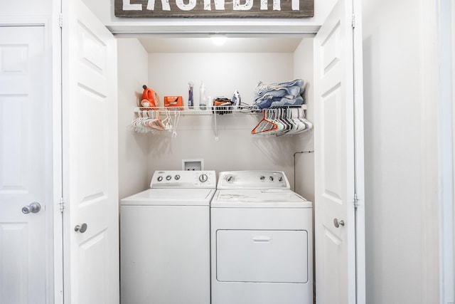 laundry room featuring separate washer and dryer