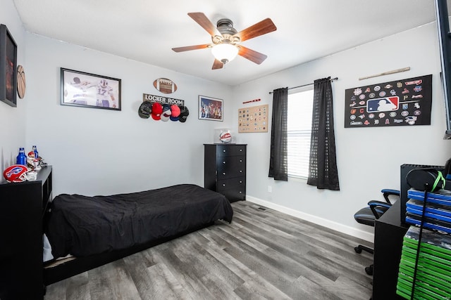 bedroom with ceiling fan and hardwood / wood-style floors