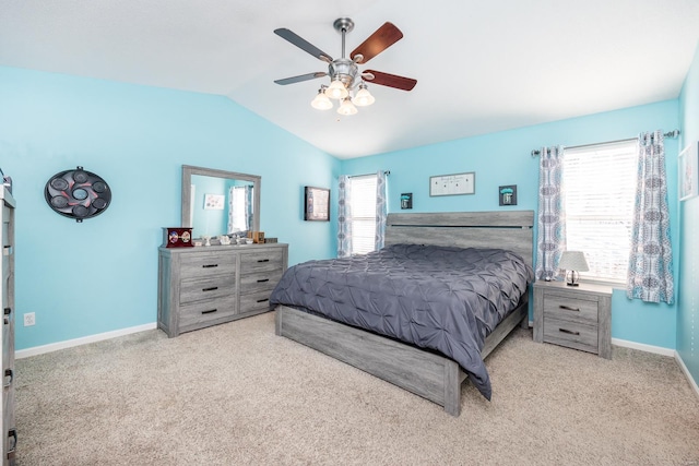 carpeted bedroom featuring ceiling fan and vaulted ceiling