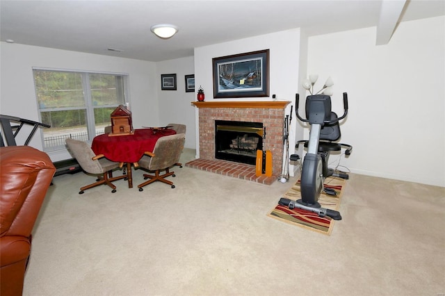 living room featuring light colored carpet and a brick fireplace