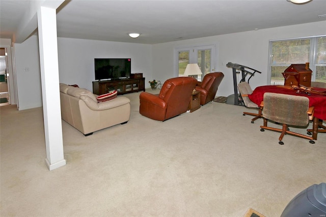 carpeted living room with french doors