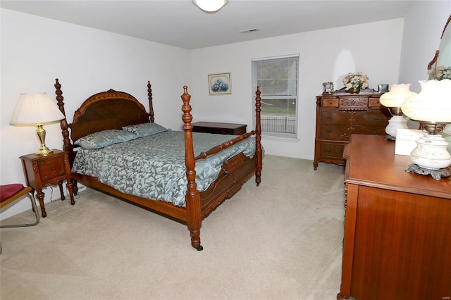 bedroom with light colored carpet