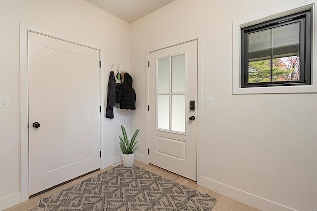 doorway with light hardwood / wood-style flooring