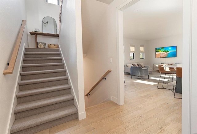 staircase featuring hardwood / wood-style floors