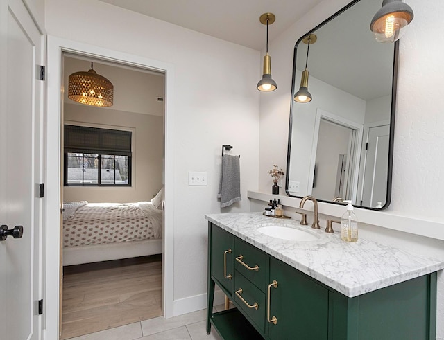 bathroom featuring vanity and wood-type flooring