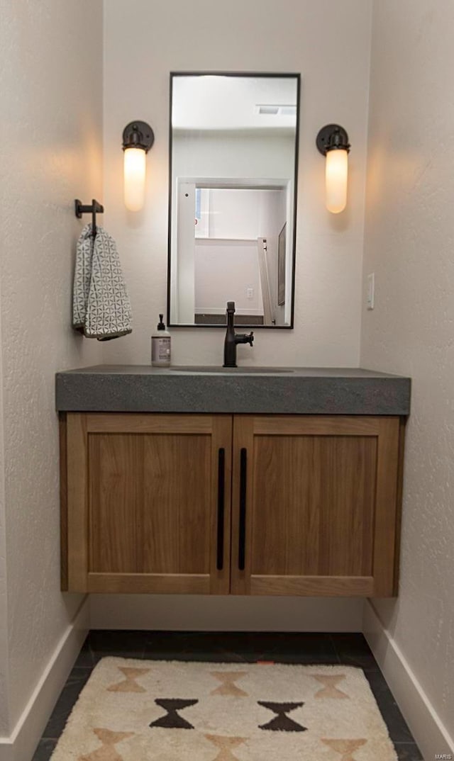 bathroom with vanity and tile patterned floors