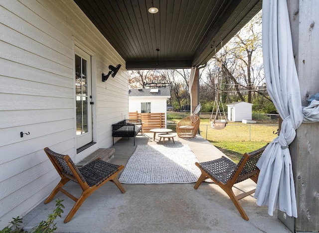 view of patio / terrace with a storage unit