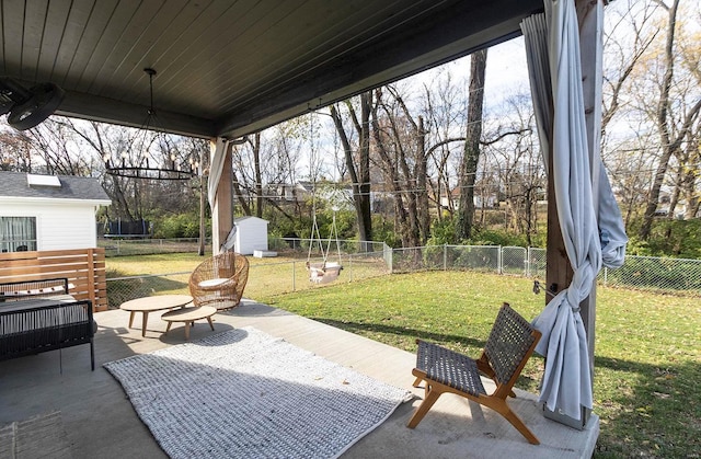 view of patio / terrace featuring a shed