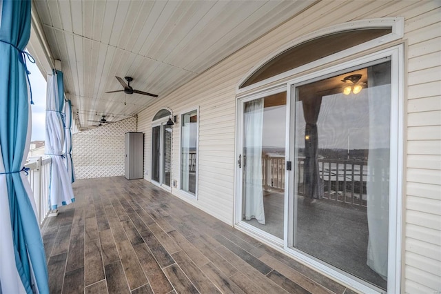 wooden deck with ceiling fan