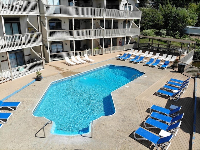 view of swimming pool featuring a patio area