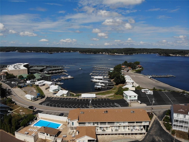 birds eye view of property with a water view