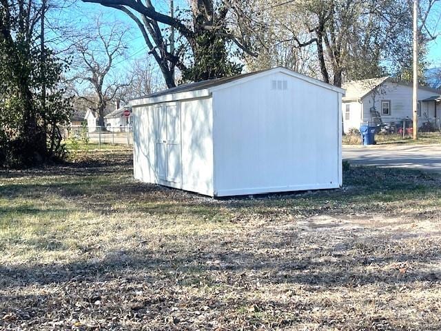 view of outdoor structure with a yard