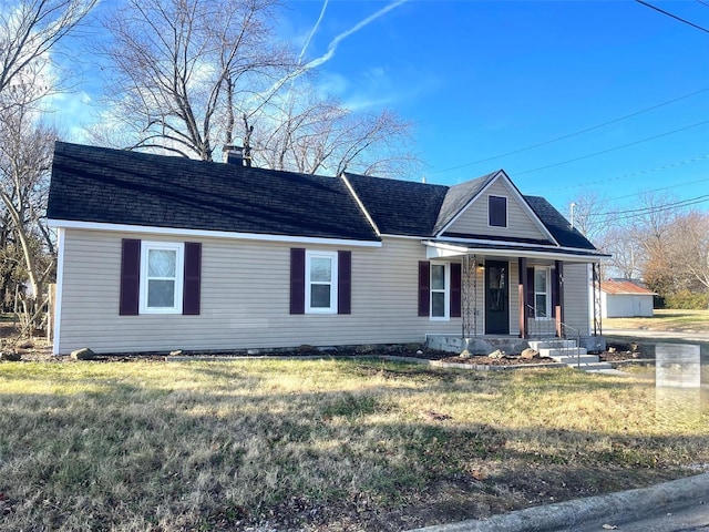 single story home featuring a front yard and covered porch