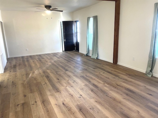 spare room featuring hardwood / wood-style flooring and ceiling fan