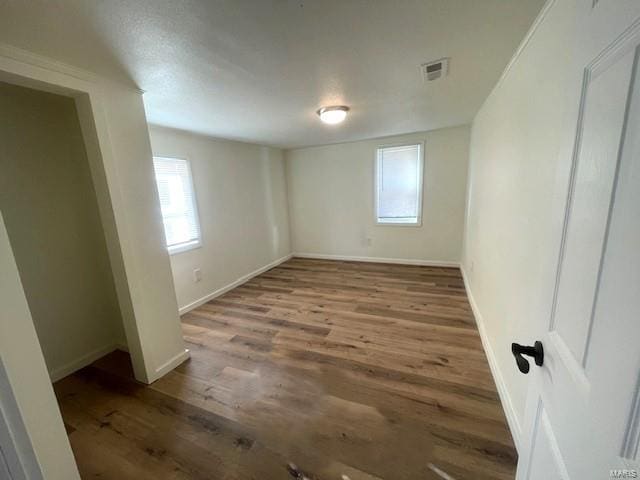 empty room featuring wood-type flooring