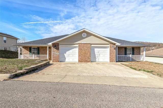 single story home featuring covered porch and a garage