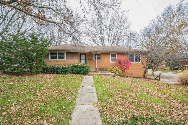 single story home with a front lawn