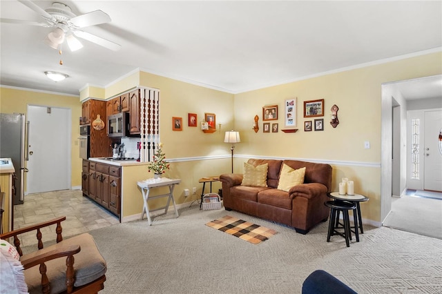 living room featuring light colored carpet, ceiling fan, and ornamental molding