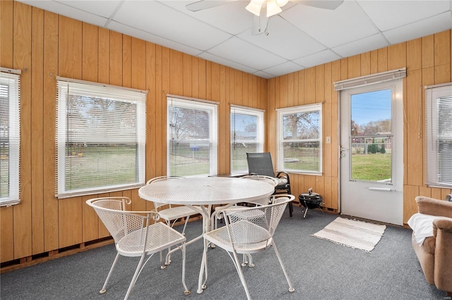 sunroom / solarium featuring a paneled ceiling and ceiling fan