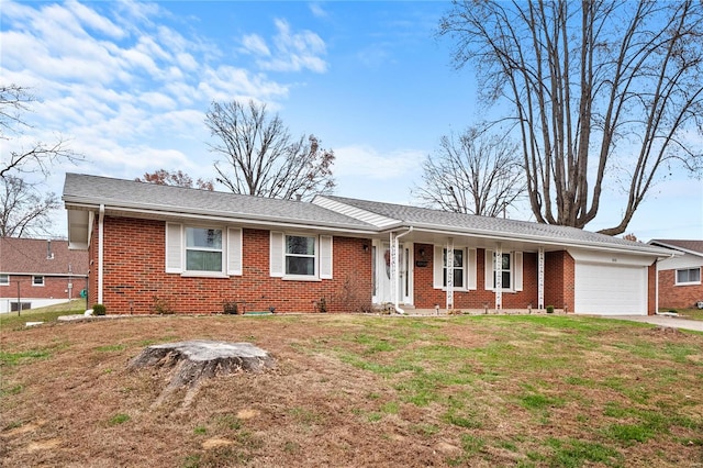 ranch-style home with a garage and a front lawn