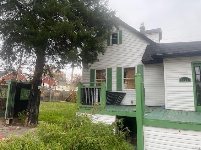 rear view of house with a lawn