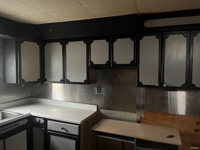 kitchen featuring a drop ceiling