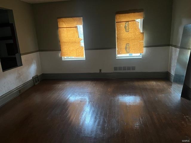 unfurnished room featuring dark hardwood / wood-style floors