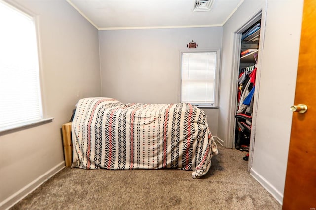 bedroom with carpet floors and ornamental molding