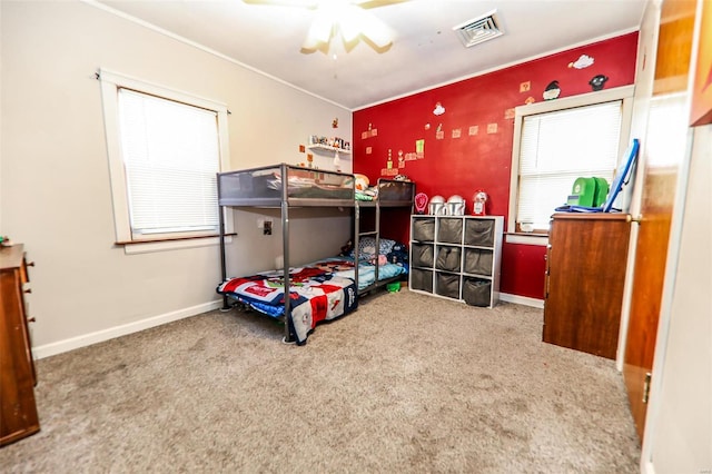 carpeted bedroom with ceiling fan