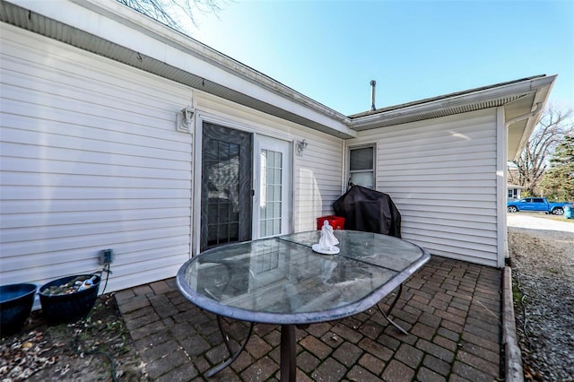 view of patio / terrace featuring outdoor dining space and a grill