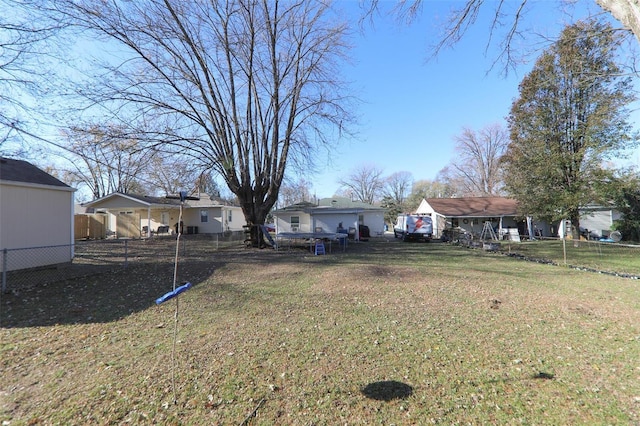 view of yard with a residential view and fence