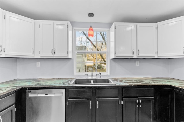 kitchen with pendant lighting, white cabinetry, sink, and appliances with stainless steel finishes