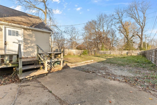 view of yard with a patio and a wooden deck