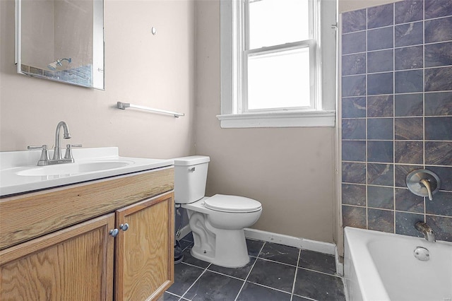 full bathroom featuring tile patterned floors, bathing tub / shower combination, vanity, and toilet