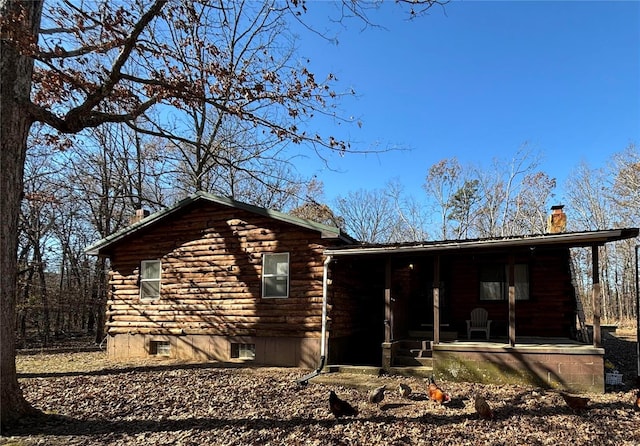 log home with covered porch