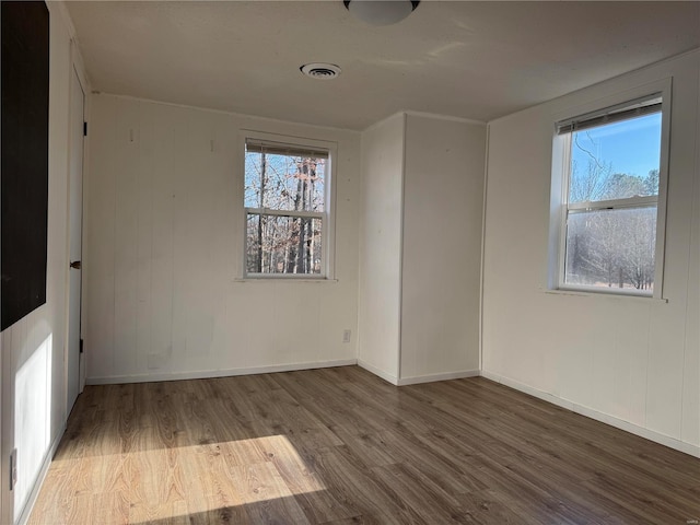 empty room featuring hardwood / wood-style flooring