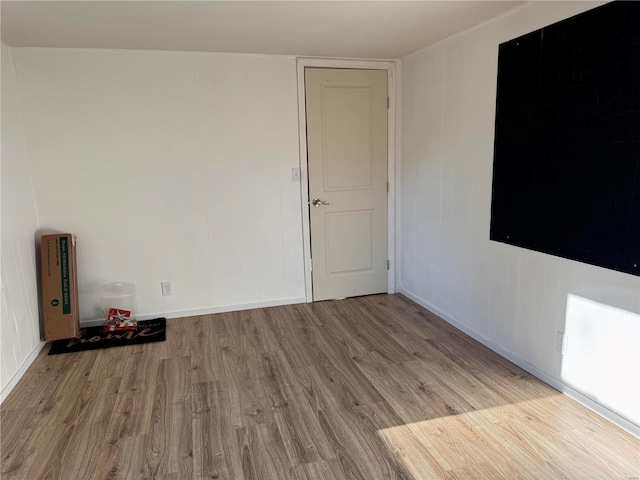 spare room with light hardwood / wood-style floors