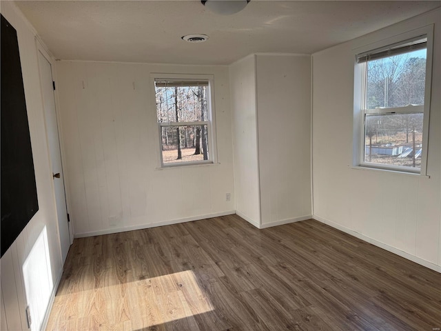 unfurnished room featuring wood-type flooring