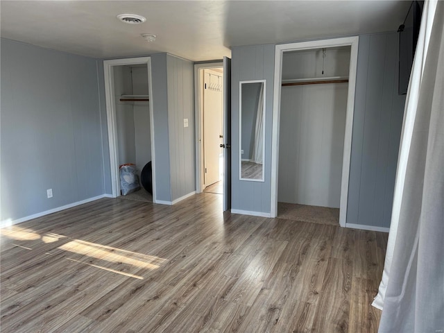 unfurnished bedroom with light wood-type flooring